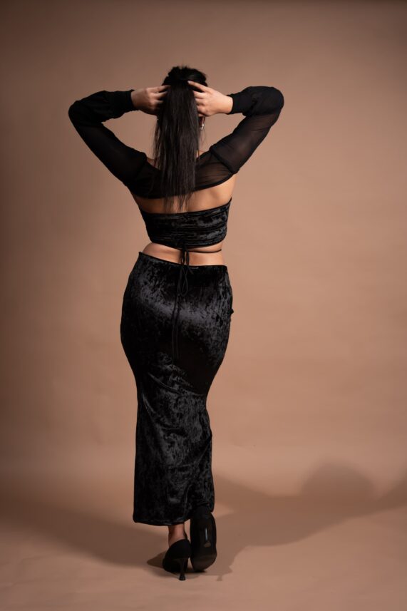 Lycra top and cutout skirt with mesh sleeves
