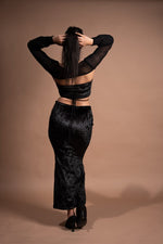 Lycra top and cutout skirt with mesh sleeves
