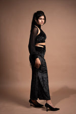 Lycra top and cutout skirt with mesh sleeves
